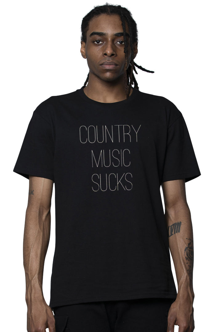 Person wearing a black t-shirt with 'COUNTRY MUSIC SUCKS' text on a white background